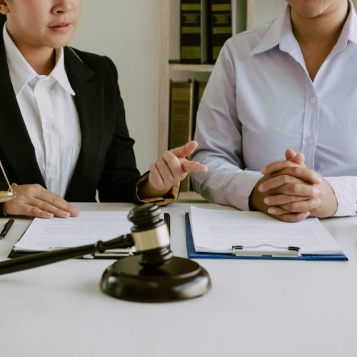 legal-advisor-is-explaining-the-offense-under-the-law-in-the-book-at-office-e1648385439641.jpg